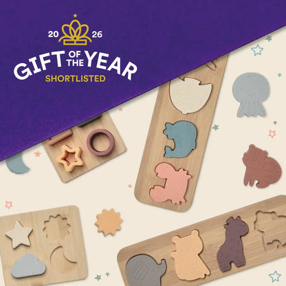 Wooden puzzle toys with animal shapes on a white background, featuring 'Gift of the Year 2026' shortlisted text.