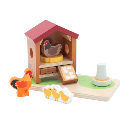 Wooden toy farm set with chicken coop, chickens, and chicks on a white background