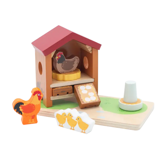 Wooden toy farm set with chicken coop, chickens, and chicks on a white background