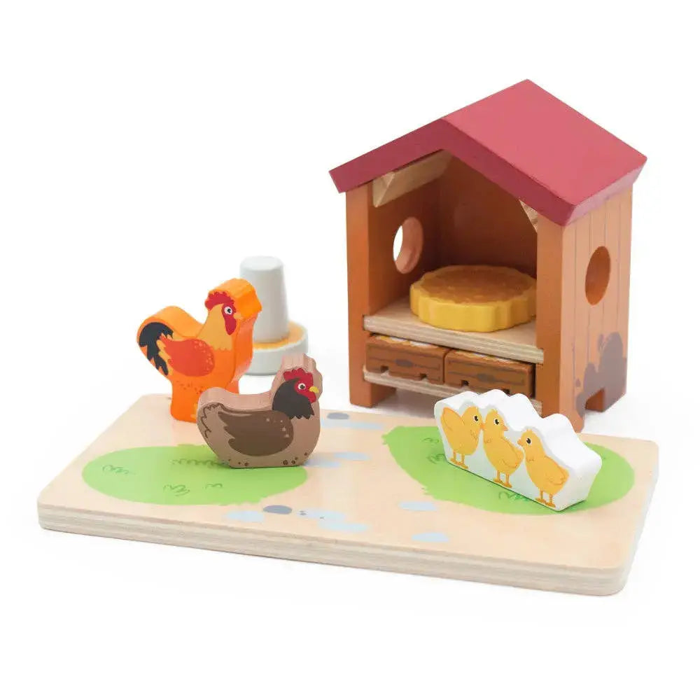 Wooden toy set with chicken coop, chickens, and chicks on a white background