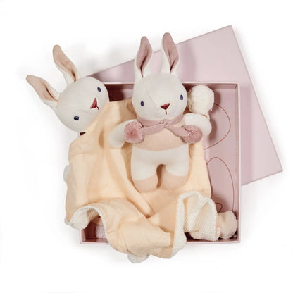 Plush rabbit toy with a blanket in a gift box on a white background