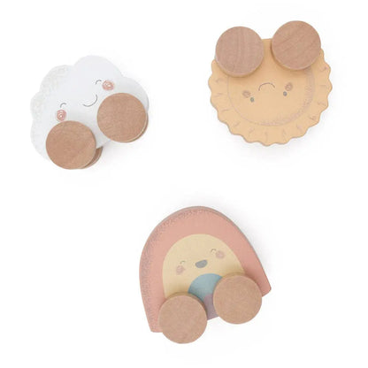 Three wooden toys on a white background