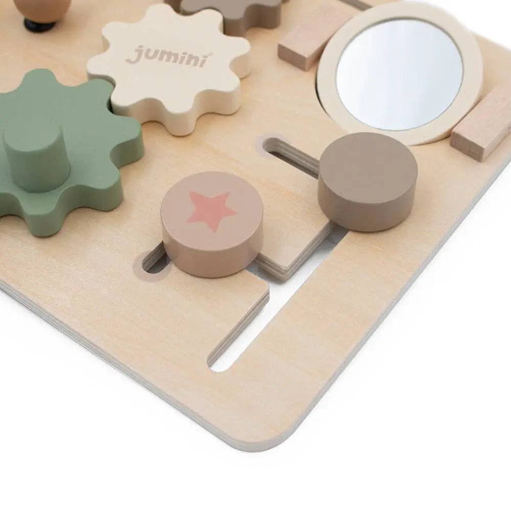 Children's wooden puzzle with various shapes and a mirror, branded 'jumini'.
