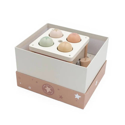 Wooden toy with colourful spheres in a box on a white background