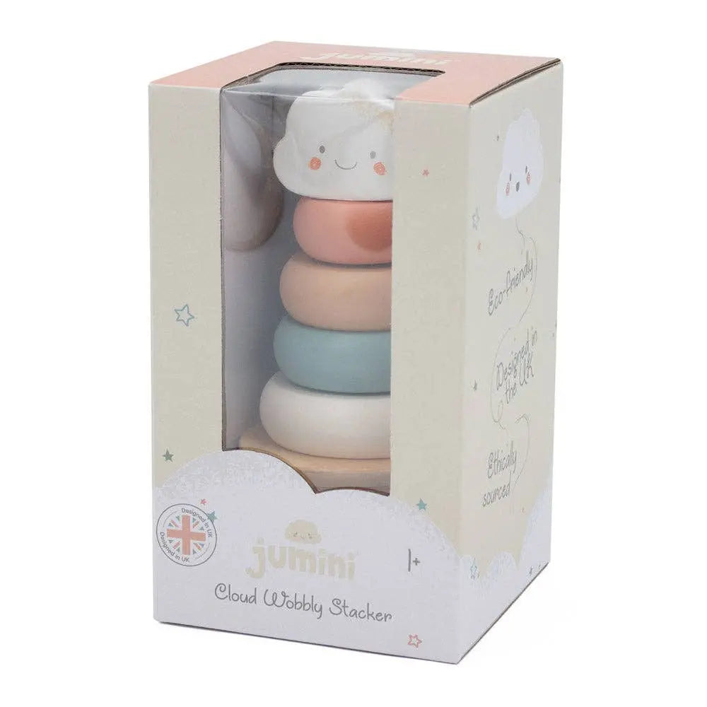 Stack of colourful baby toys in a box with 'jumini' branding