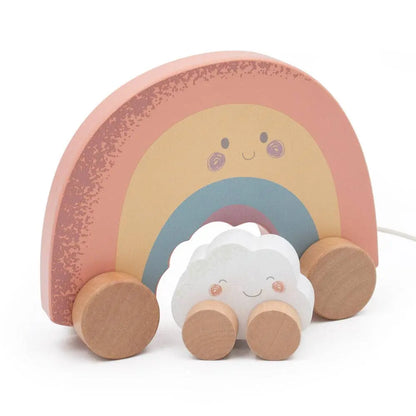 Wooden toy rainbow with a cloud on wheels on a white background