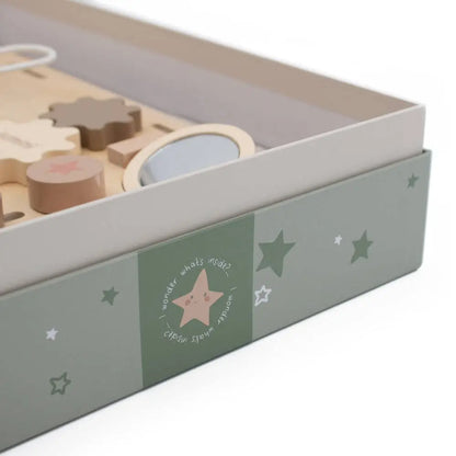Wooden toy set in a box with star patterns on a white background