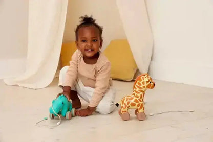 Child playing with toys on a light-coloured floor