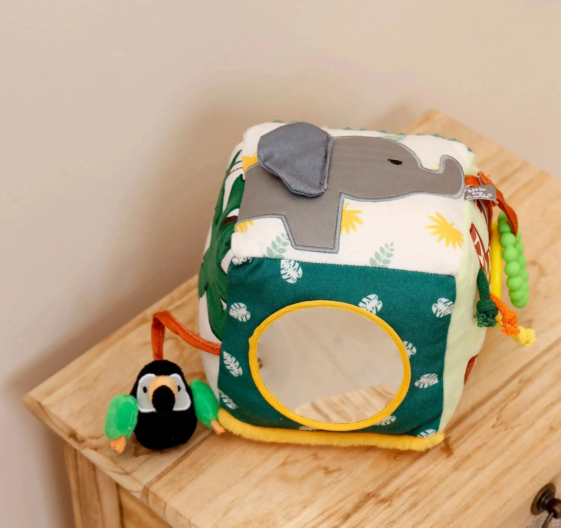 Children's toy with elephant design on a wooden surface