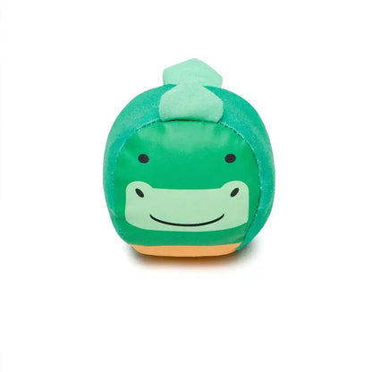 Green plush toy with a smiling face on a white background