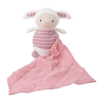 Knitted lamb toy with a pink blanket on a white background