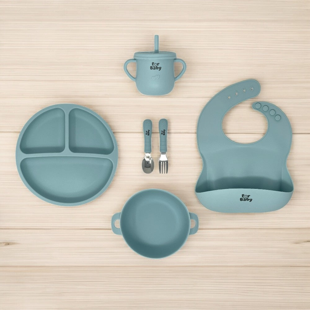 6 piece silicone baby feeding set on wooden counter top