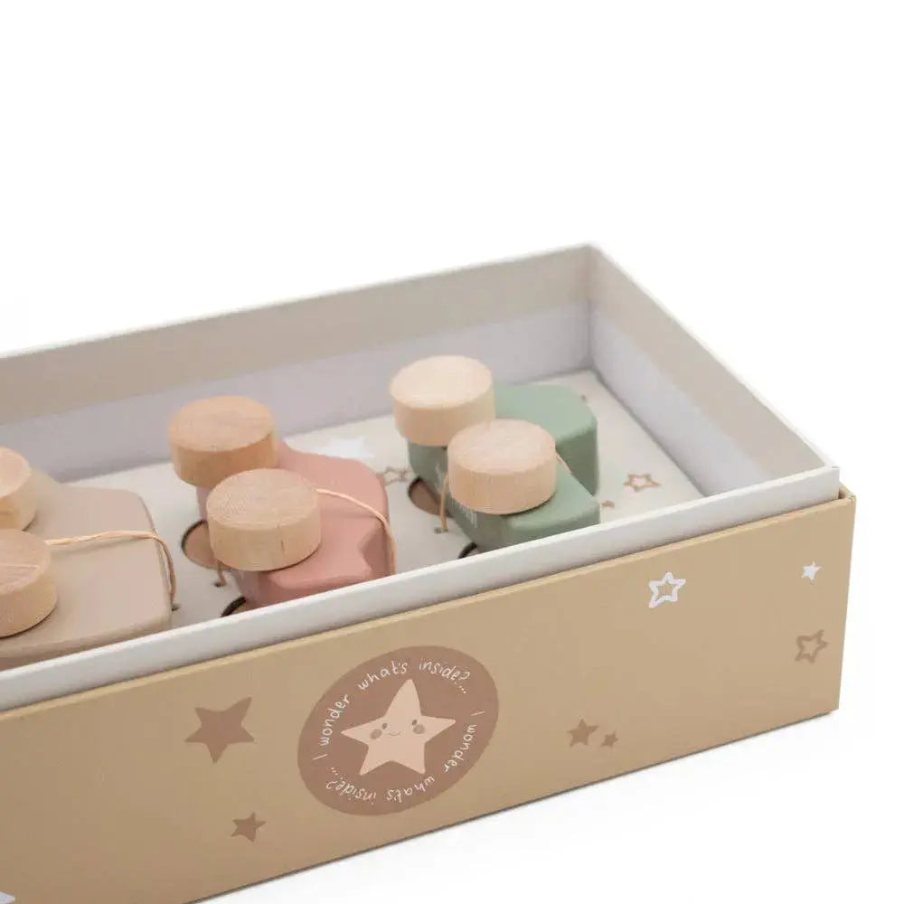 Set of small wooden cars in a decorative box on a white background