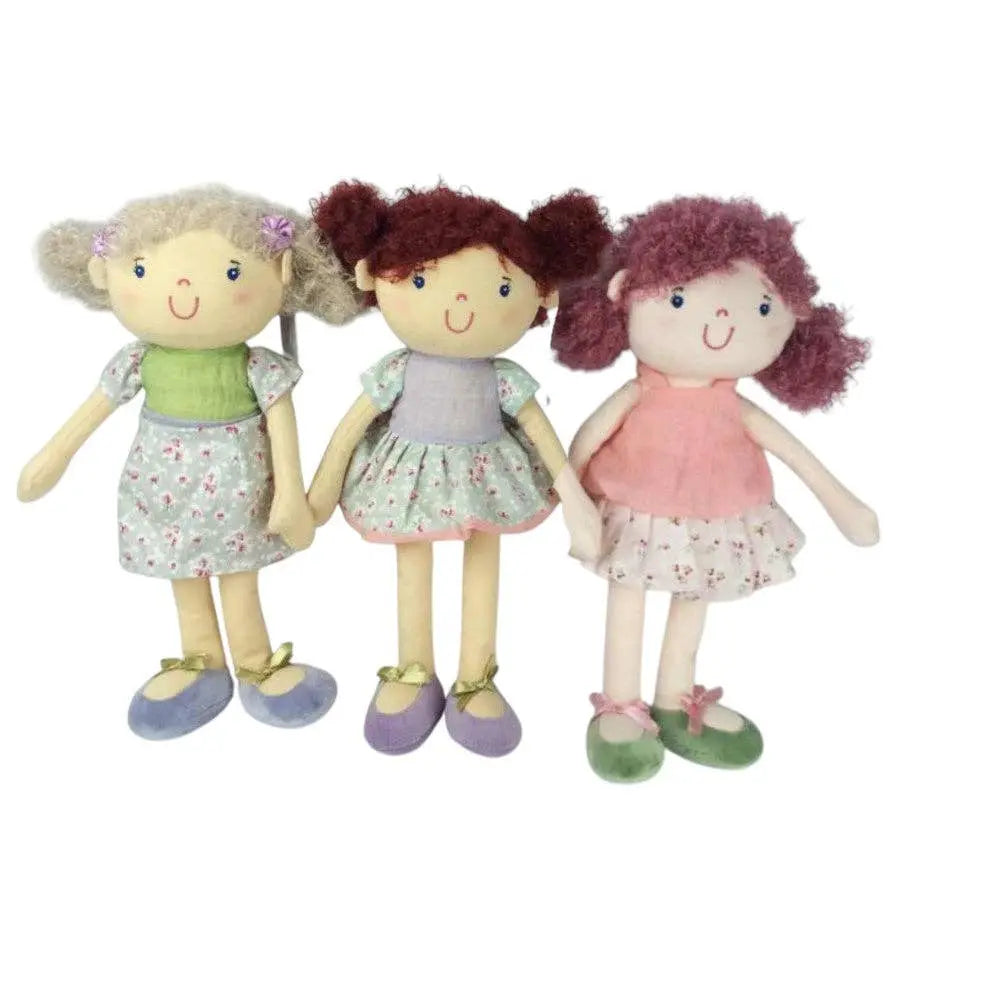 Three dolls with different hairstyles and outfits on a white background