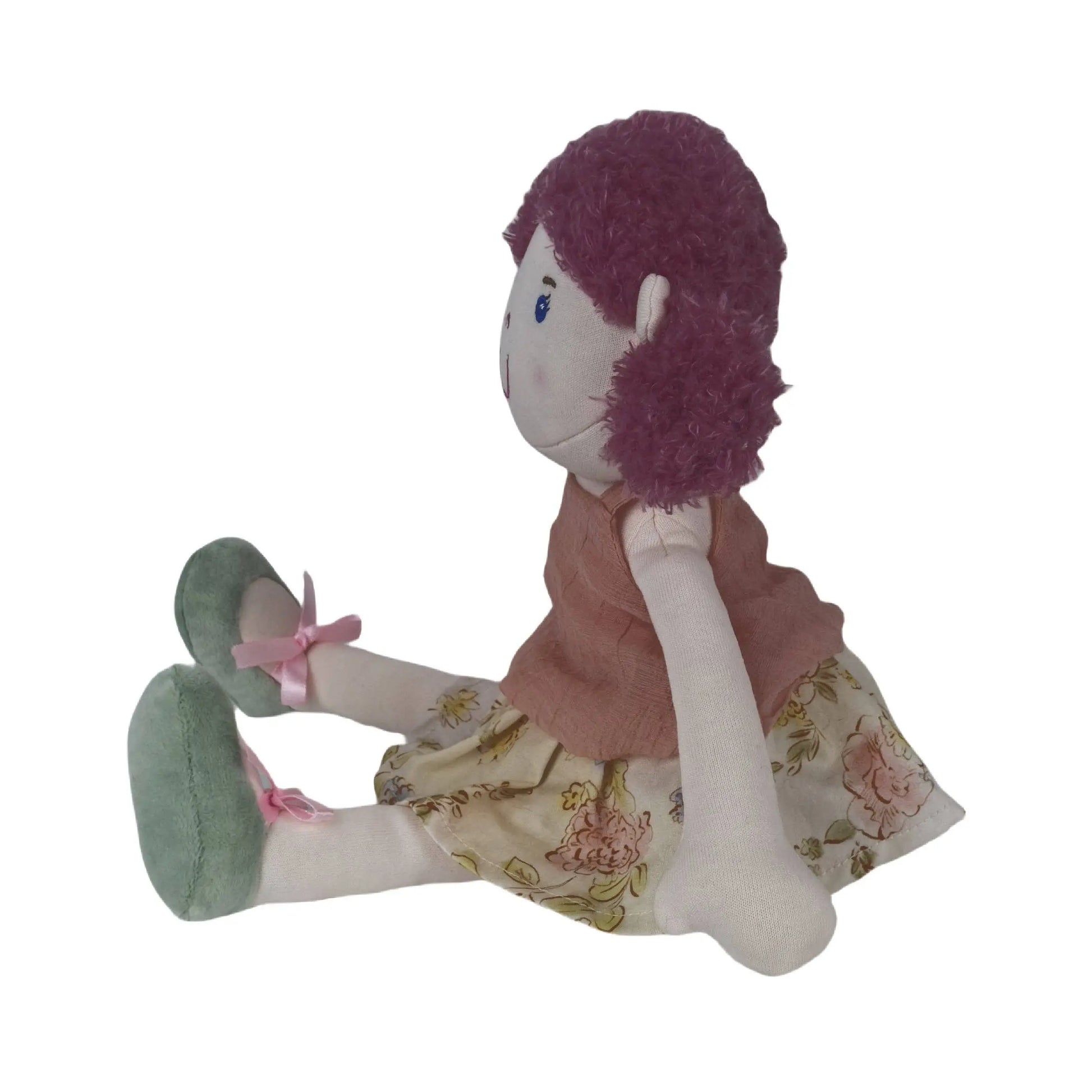 Plush toy doll with purple hair and floral dress on a white background