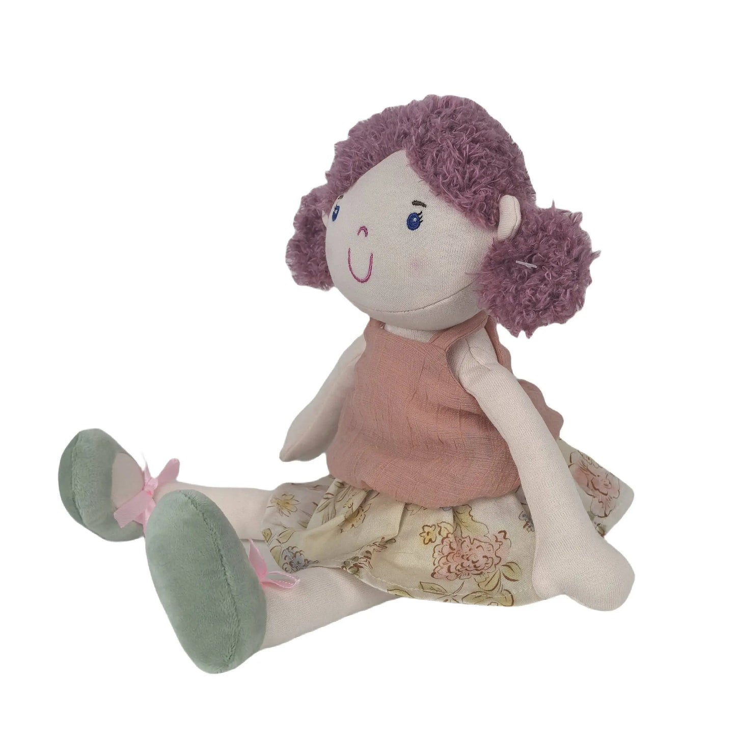 Plush toy doll with a pink top and floral skirt on a white background