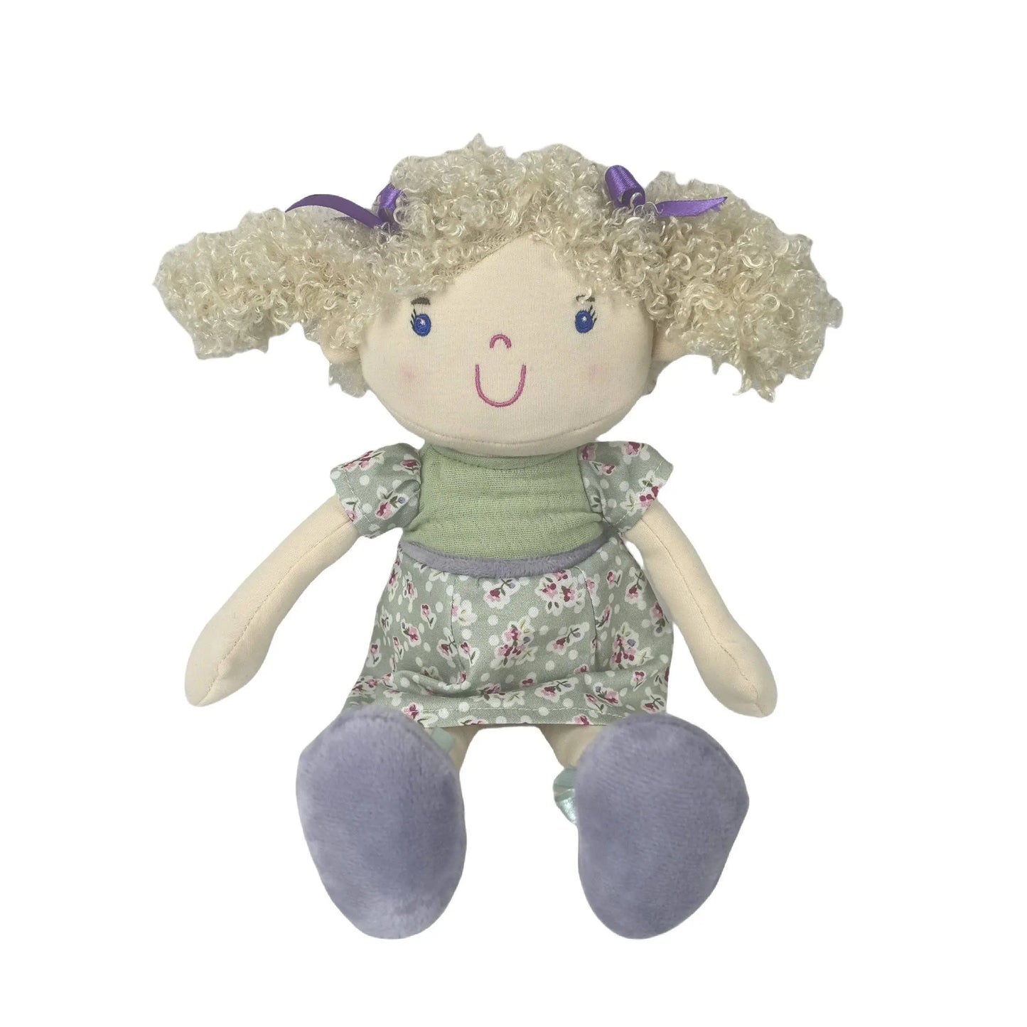 Plush toy doll with blonde hair, floral dress, and purple shoes on a white background