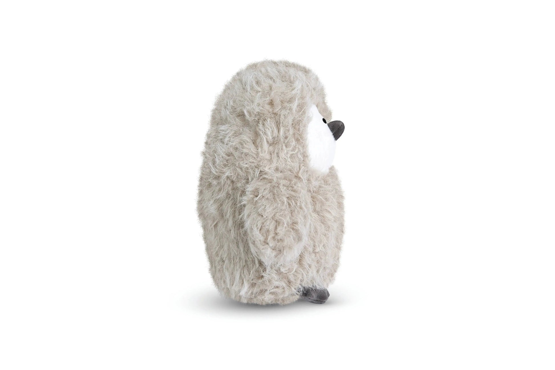 Plush penguin toy on a white background