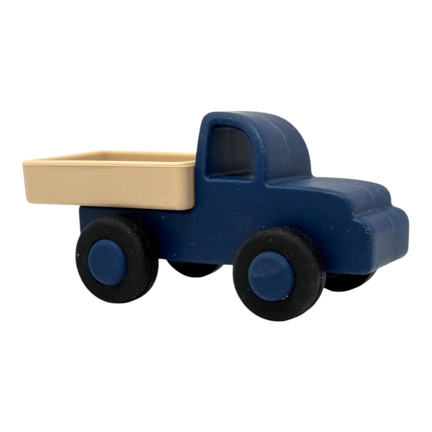 Toy truck with blue body and beige bed on a white background