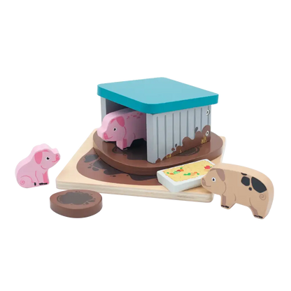Wooden toy set with pigs and a barn on a white background