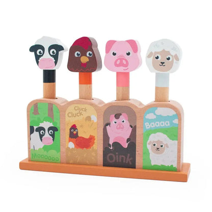 Wooden farm animal toy with animal faces and sounds on a white background