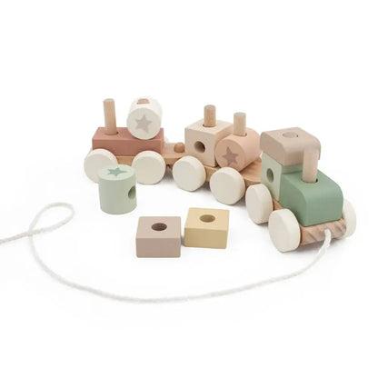 Wooden toy train with colourful blocks on a white background