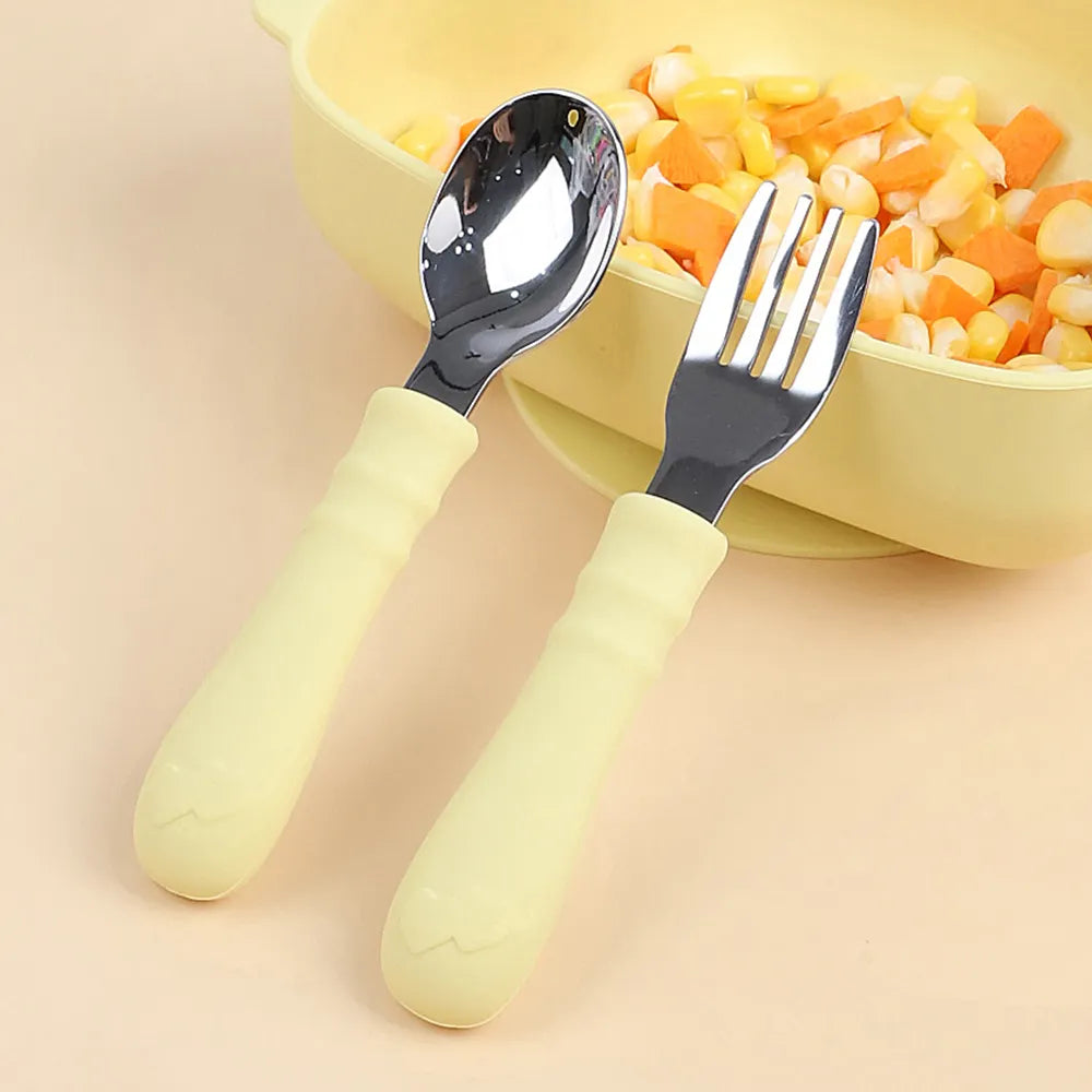 Gift-ready stainless steel and silicone baby cutlery set, ideal for mealtime training.