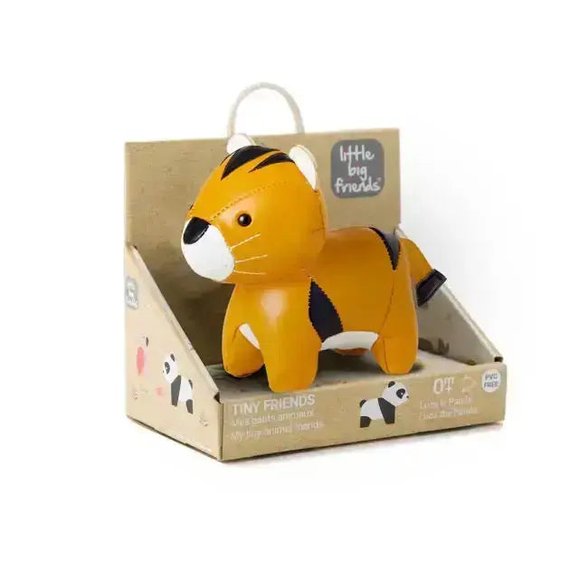 Toy tiger in a cardboard packaging with 'Little Big Friends' branding on a white background