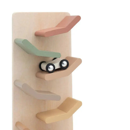 Wooden toy with shelves and a toy car on a white background