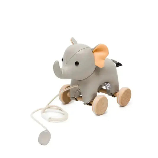 Toy elephant with wheels and a pull string on a white background