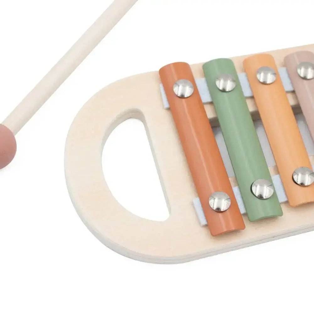 Close-up of a colourful wooden xylophone with three keys on a white background